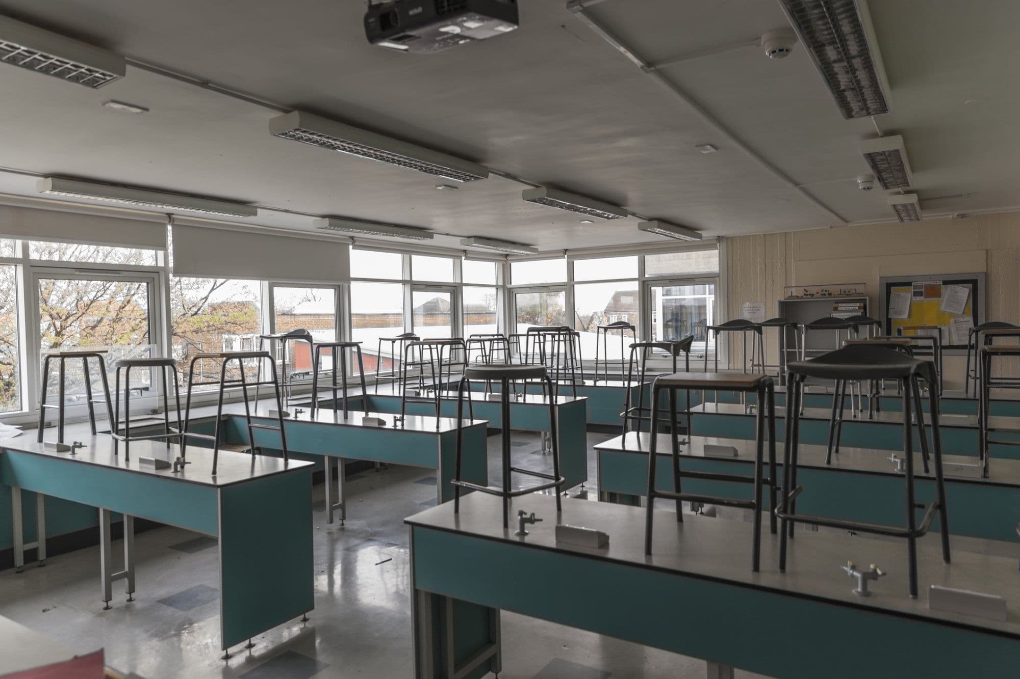 School science classroom with lab benches and stools