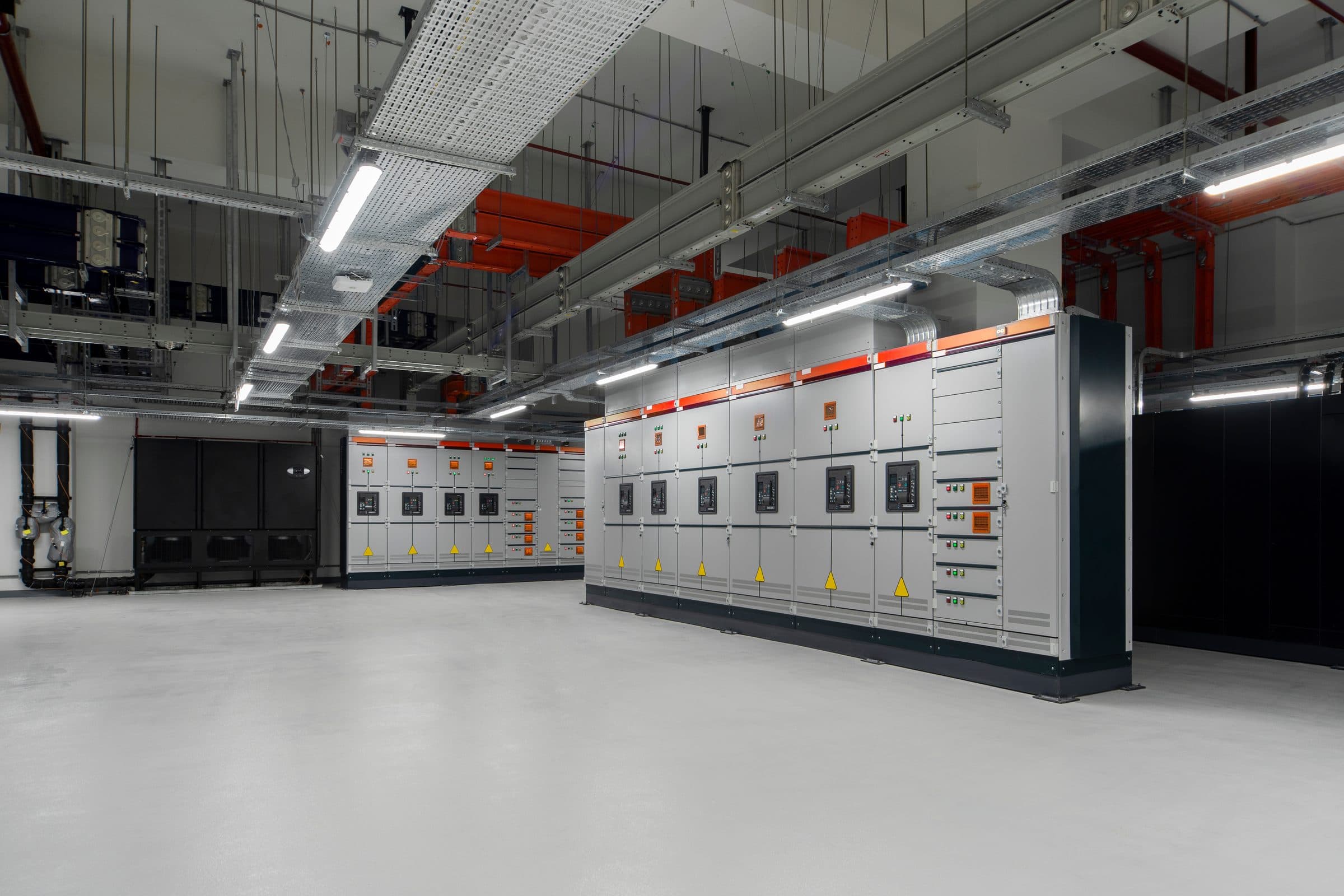 Clean switch room with rows of electrical switchgear