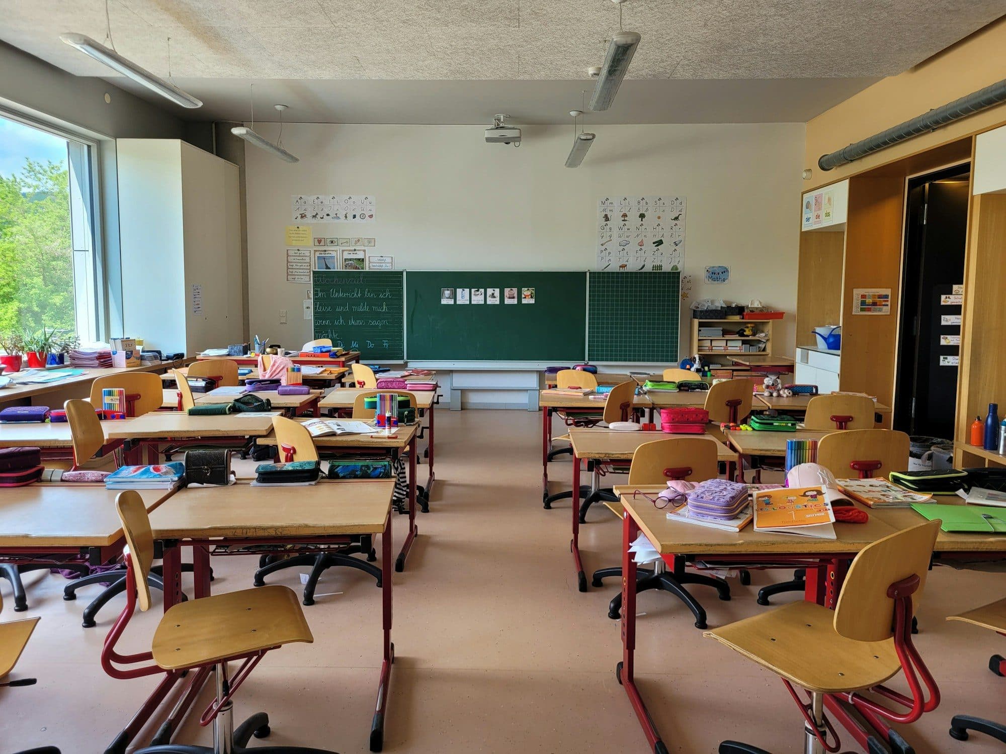 Empty classroom with rows of desks and chairs